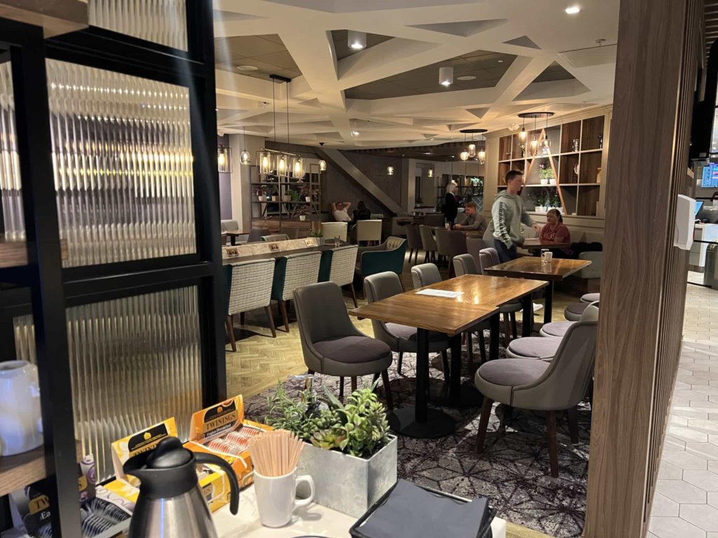 Tables and chairs within the more formal dining area, taken from the buffet area