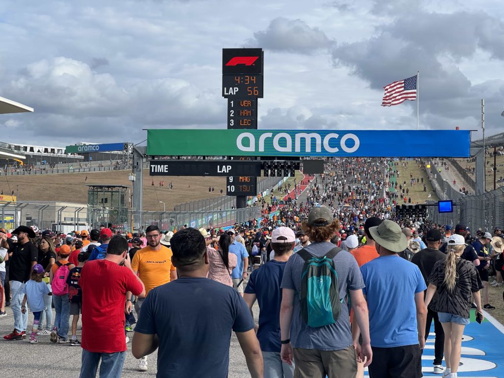 Thousands of fans on the pit straight at COTA, walking towards Turn 1