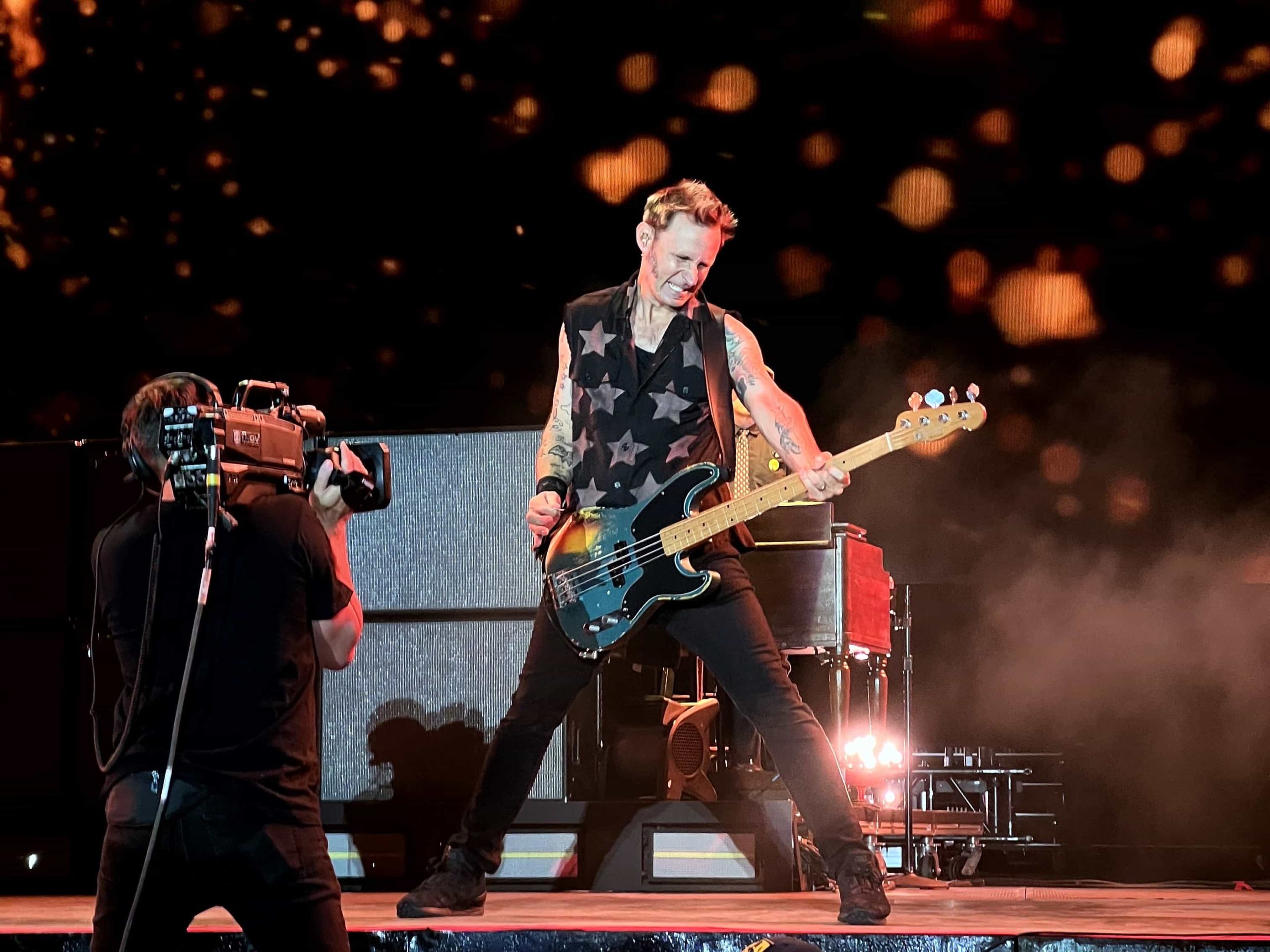 Mike Dirnt from Green Day playing bass in front of Fender amps