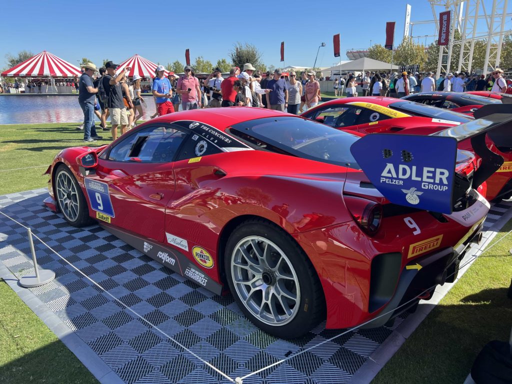 The rear quarter of a Ferrari 488 Challenge Evo, on display at a historics exhibition