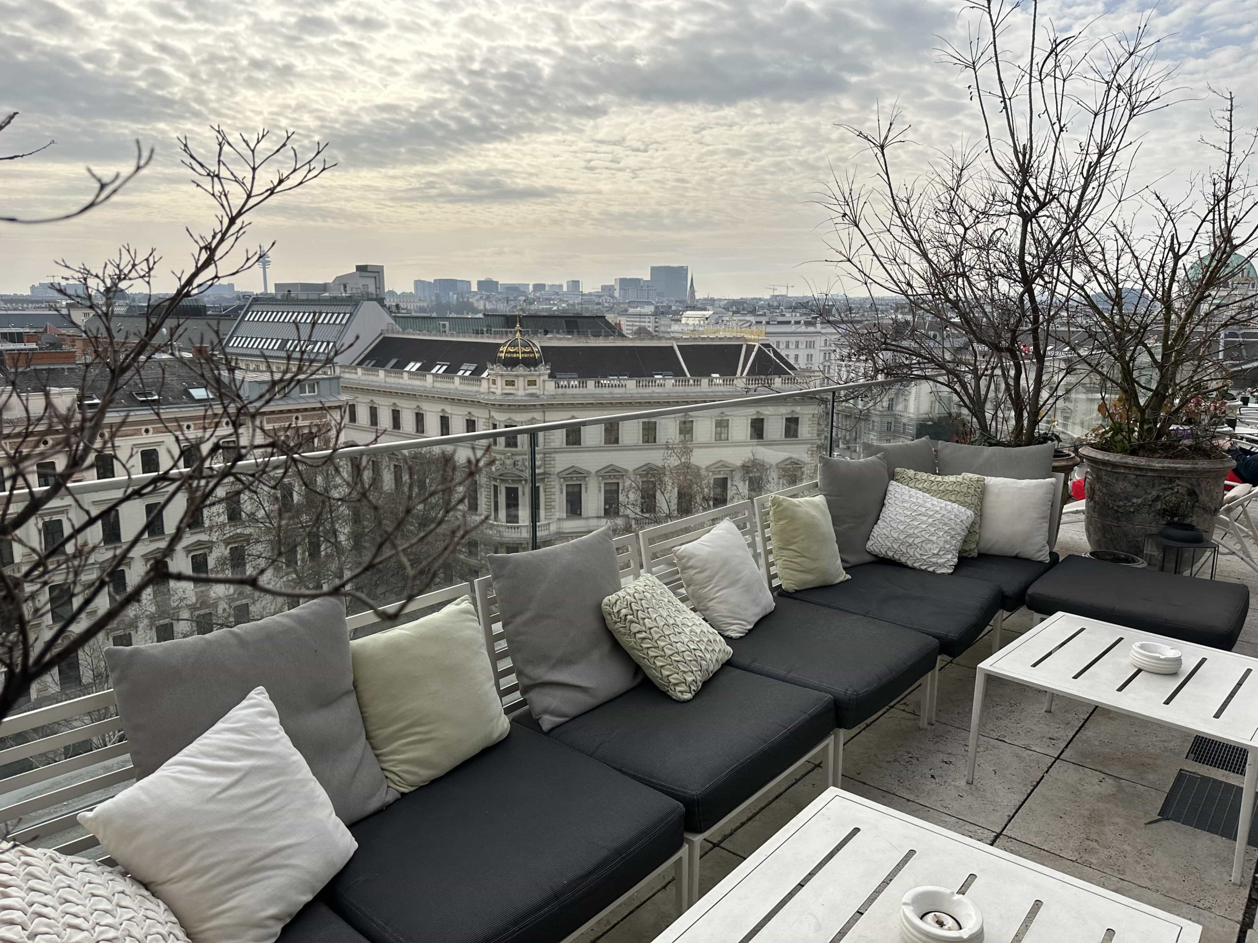 Comfortable outdoor seating within a rooftop terrace in a hotel