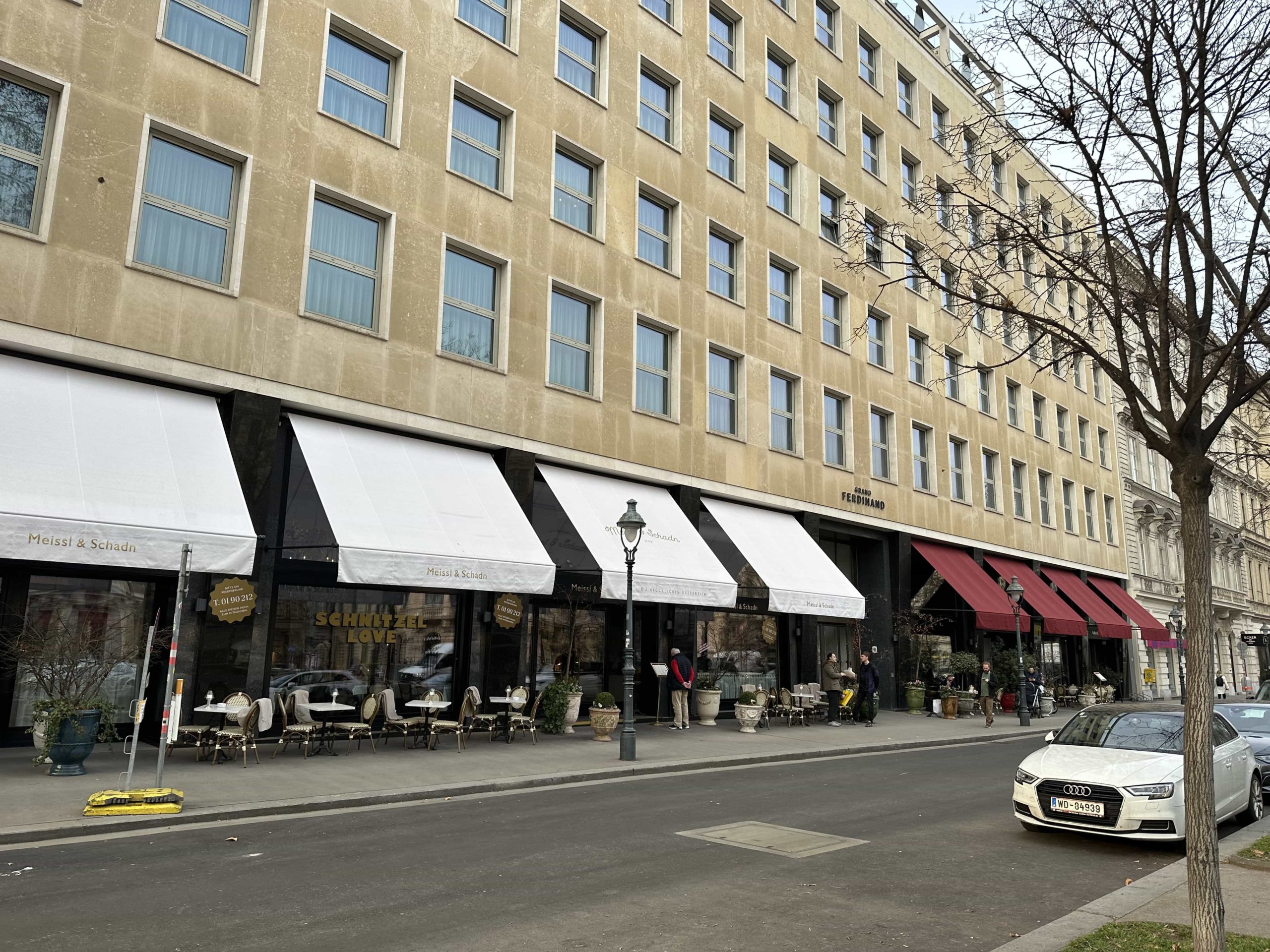 The slab-faced exterior of Hotel Grand Ferdinand, with two of the hotel's restaurants visible