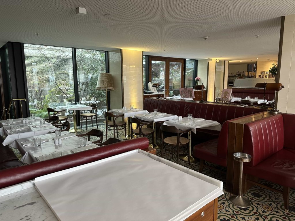 Diner-style padded bench seating, within an Austrian-themed hotel restaurant