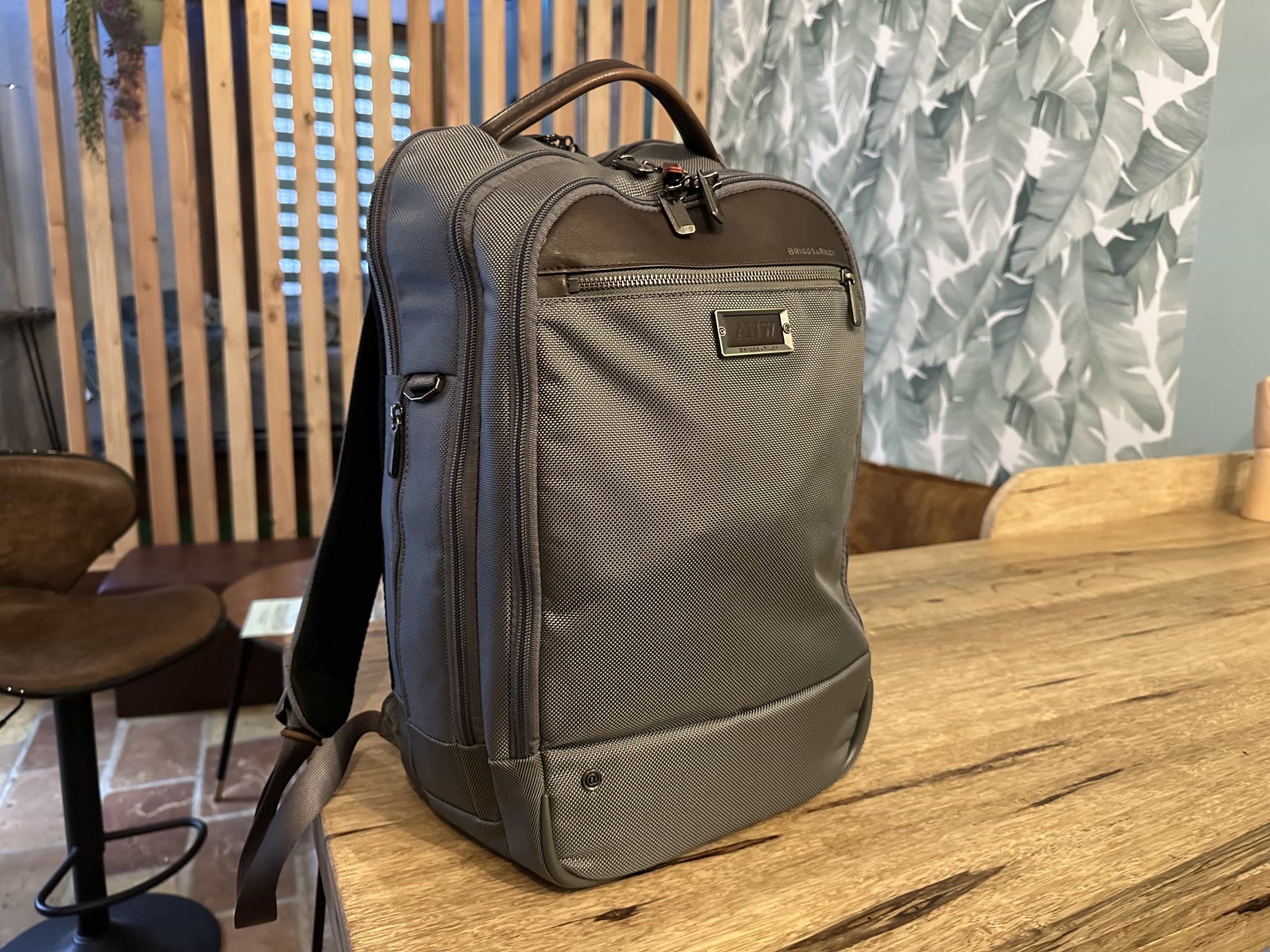A fully-packed backpack on top of a kitchen countertop