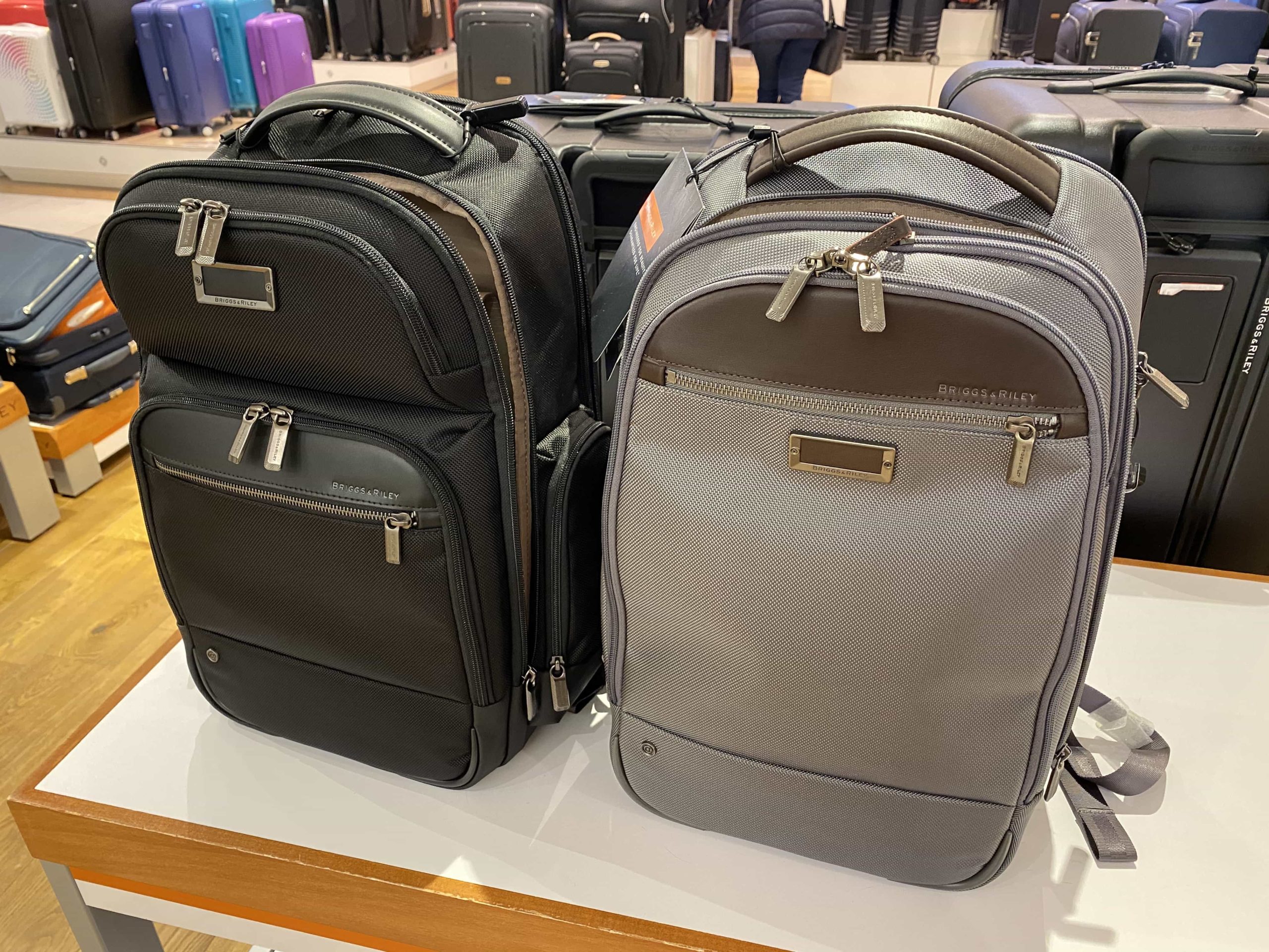 Two backpacks, side-by-side, as part of a display in a department store