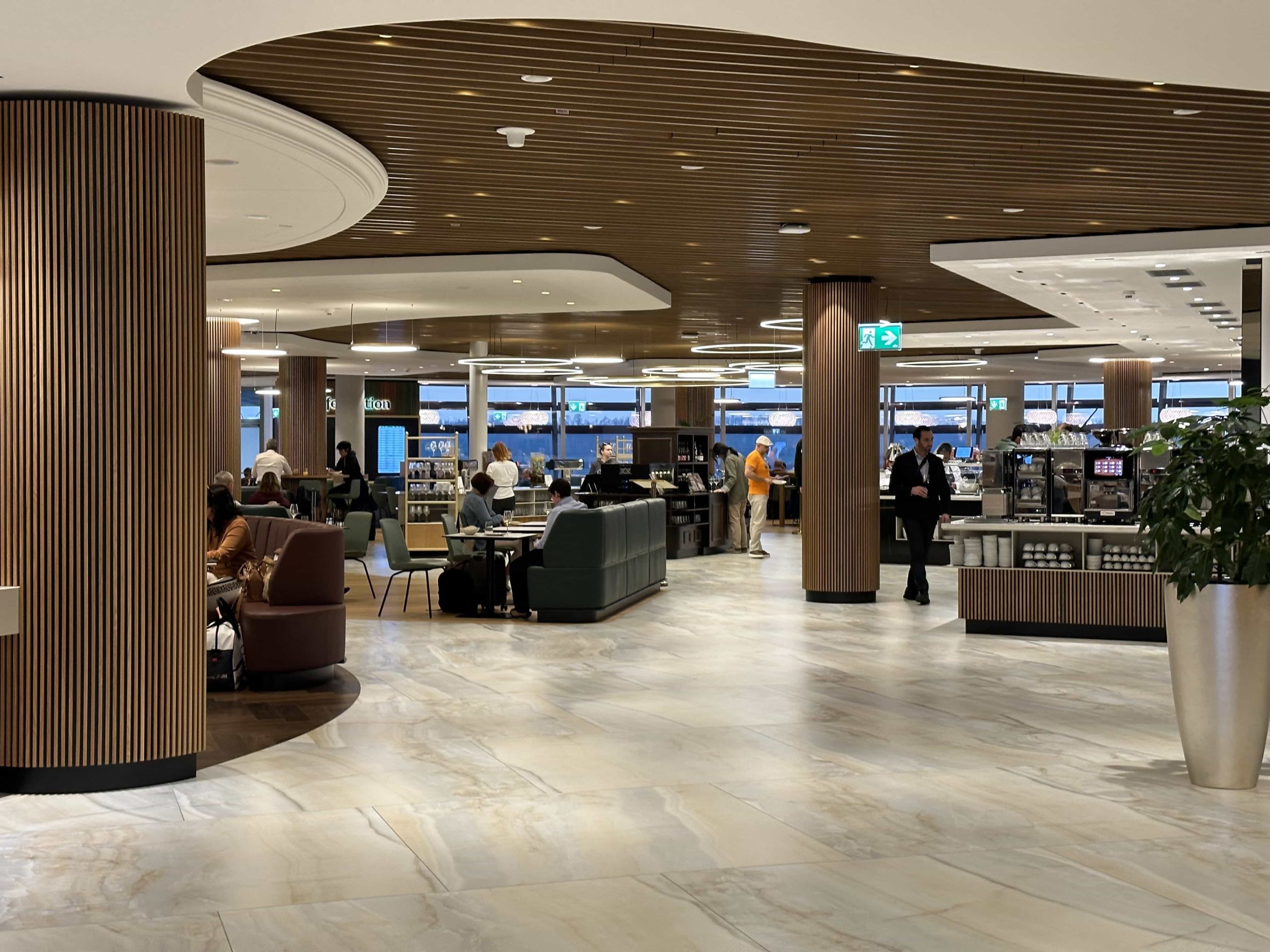 A view across a large open space within an airport lounge