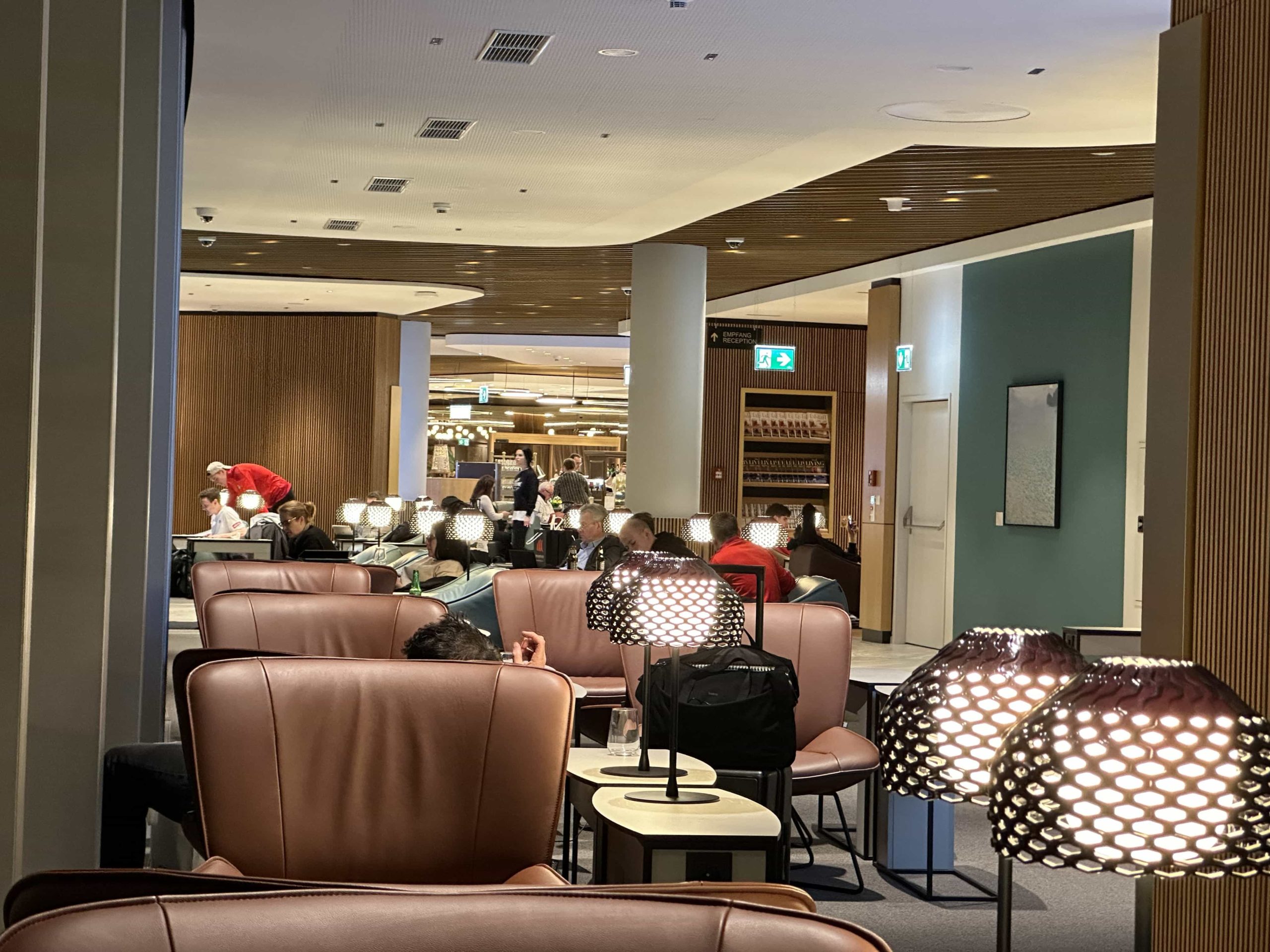 Comfortable leather lounge seating within an off-shoot of an airport lounge