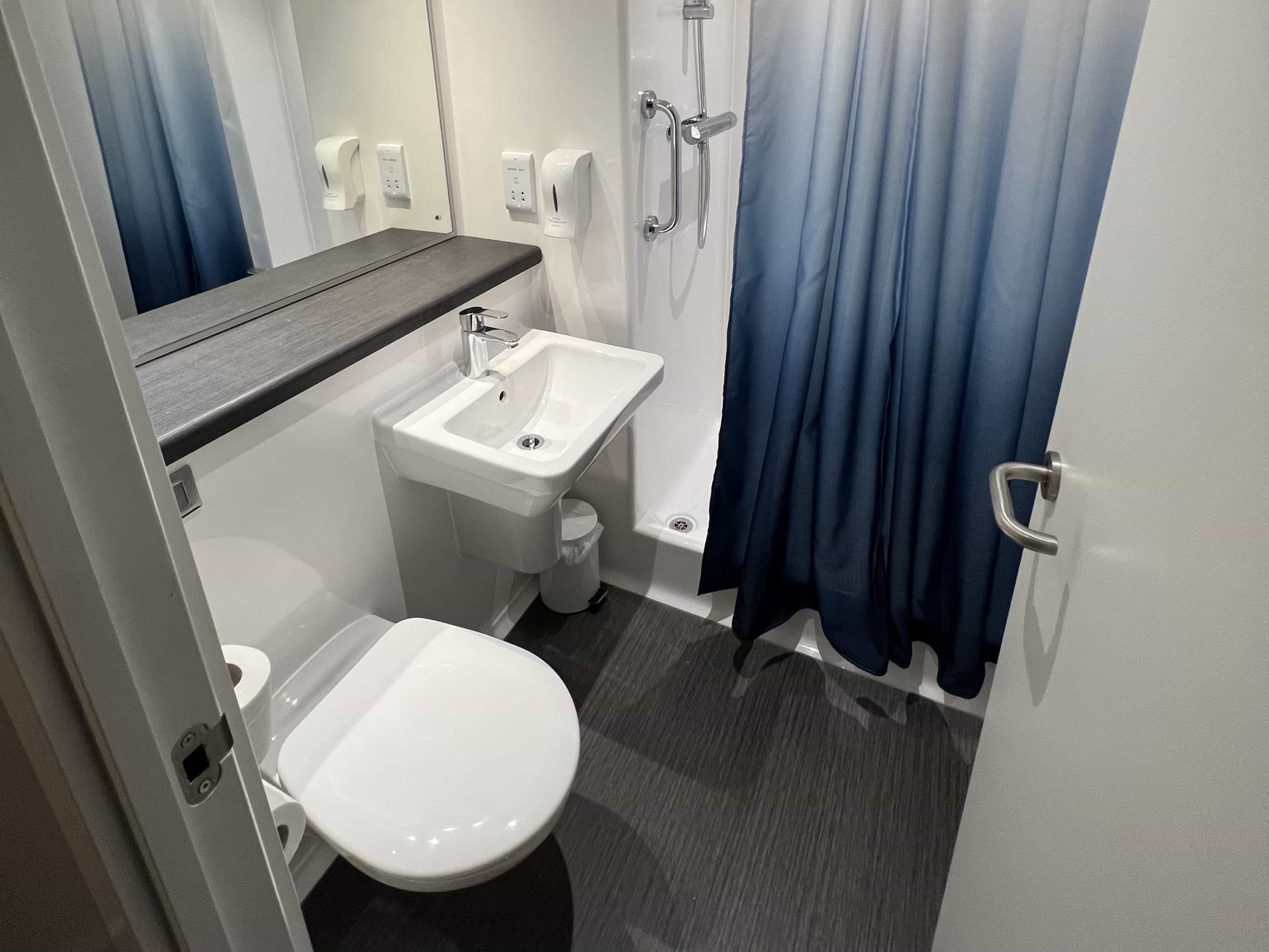 A bathroom in a modern Travelodge room