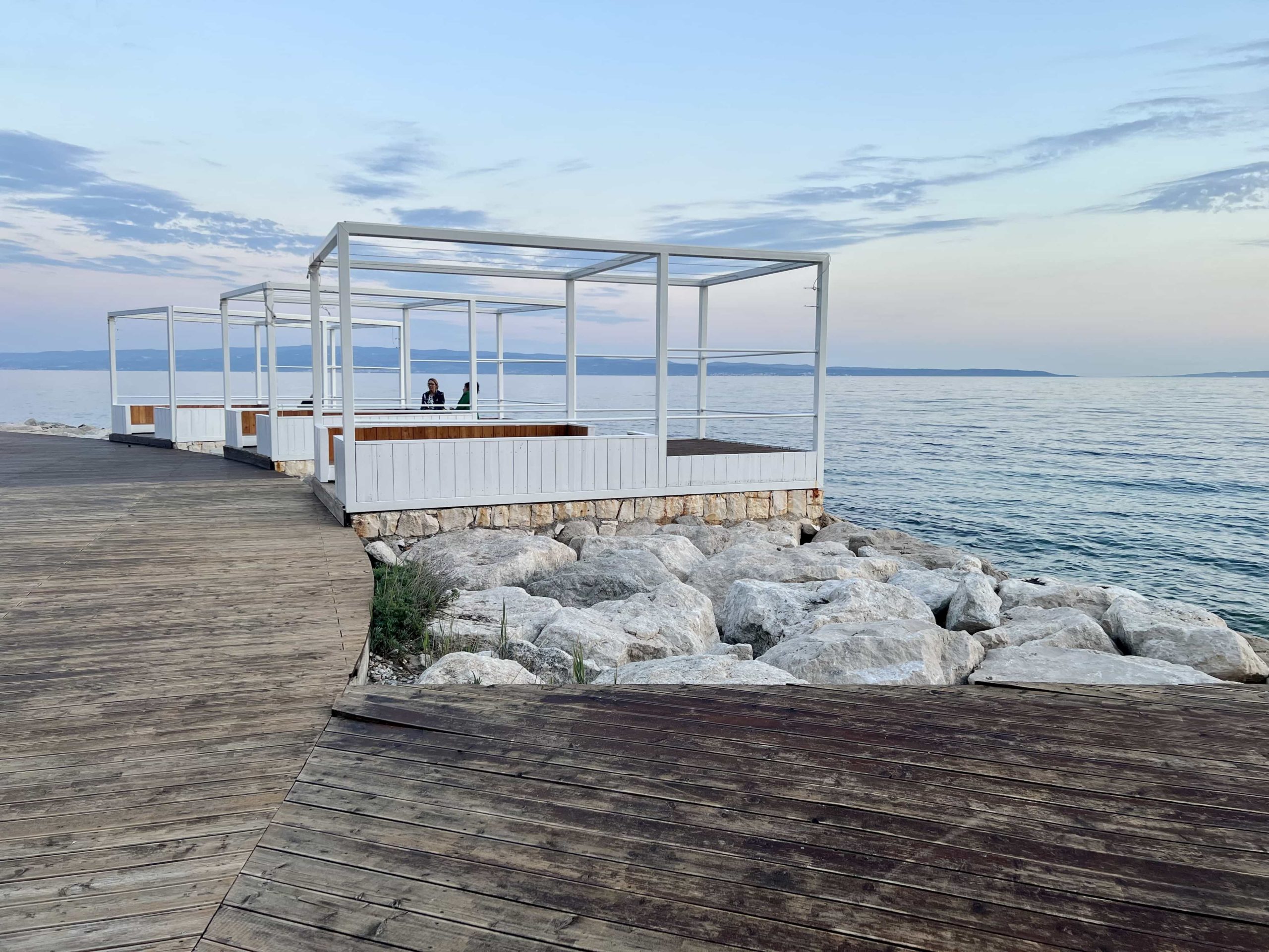 A lineup of cabanas on the shoreline of the Mistral Beach Club