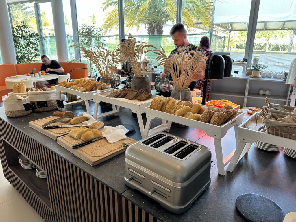 Pastries and bread within a breakfast buffet setup