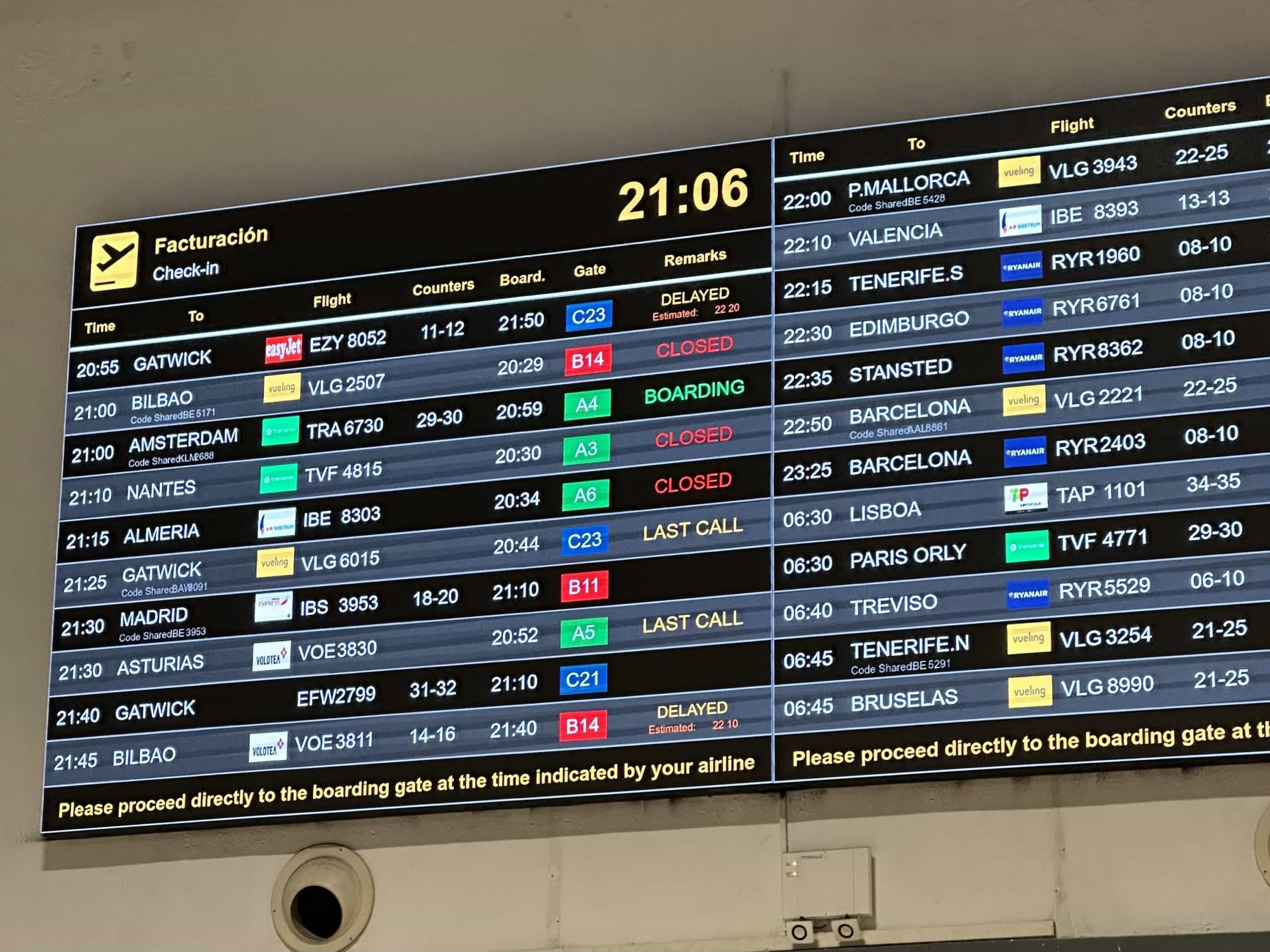 A large departures board in Seville Airport
