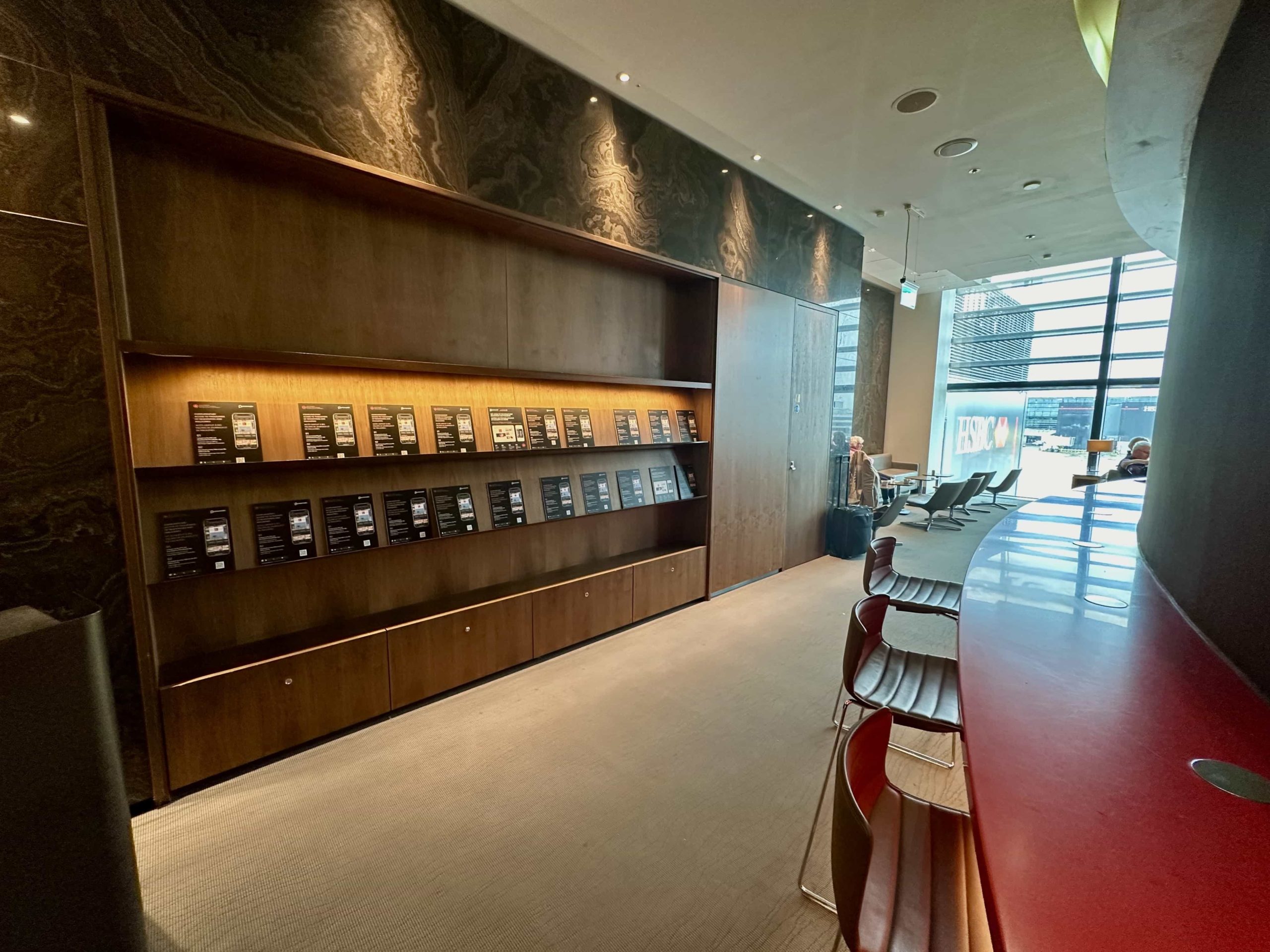 Racks of magazines behind a raised bar area for working from