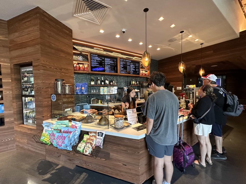 "The Flyby" takeaway counter, with a display cabinet of pastries, and a menu of food to order