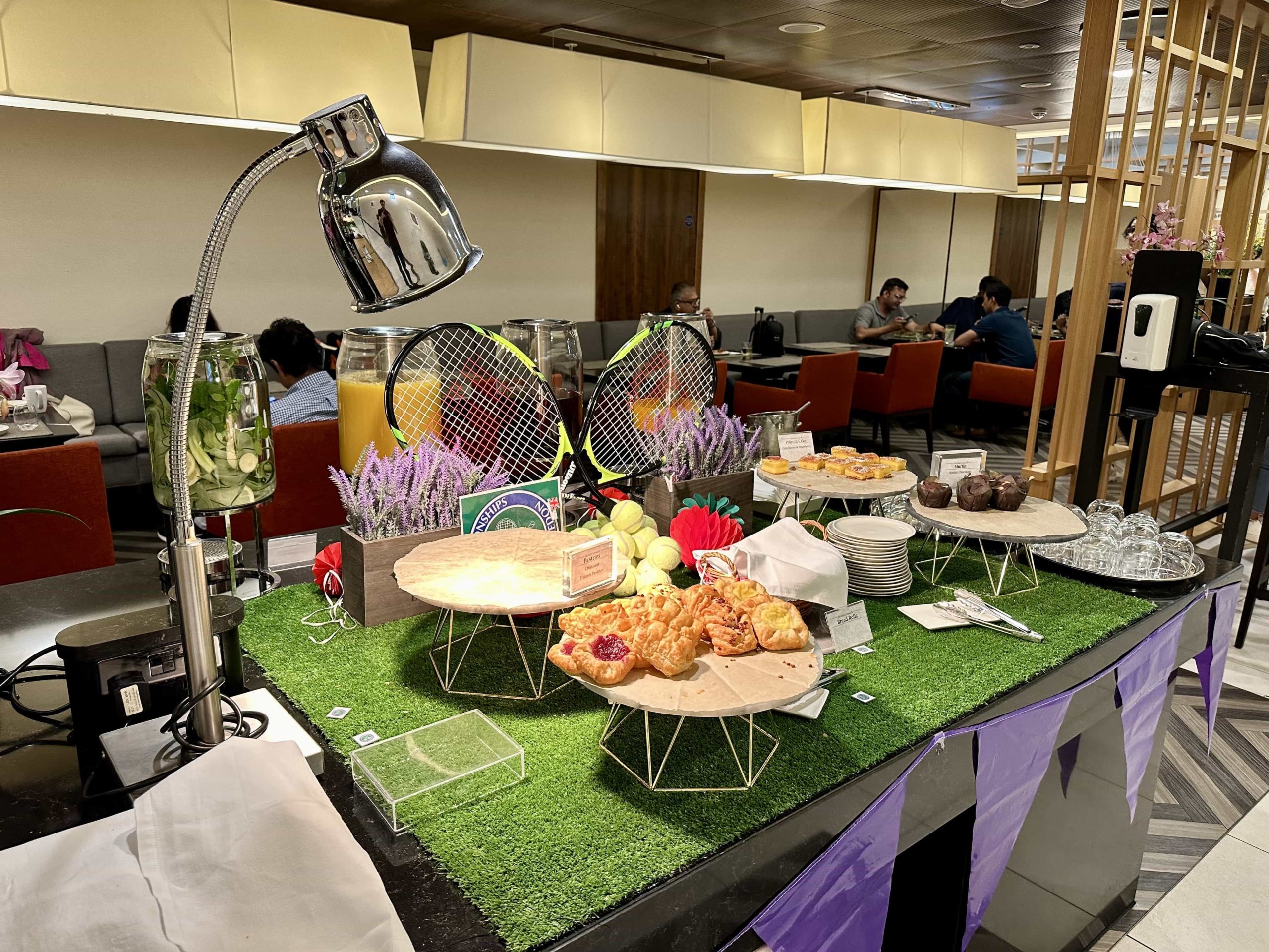 A Wimbledon-themed table, upon which a range of desserts are being served